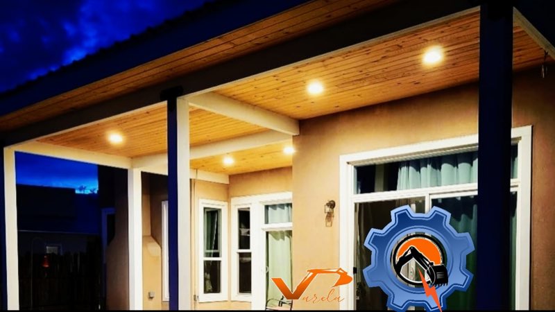 Covered patio with warm recessed lighting at dusk